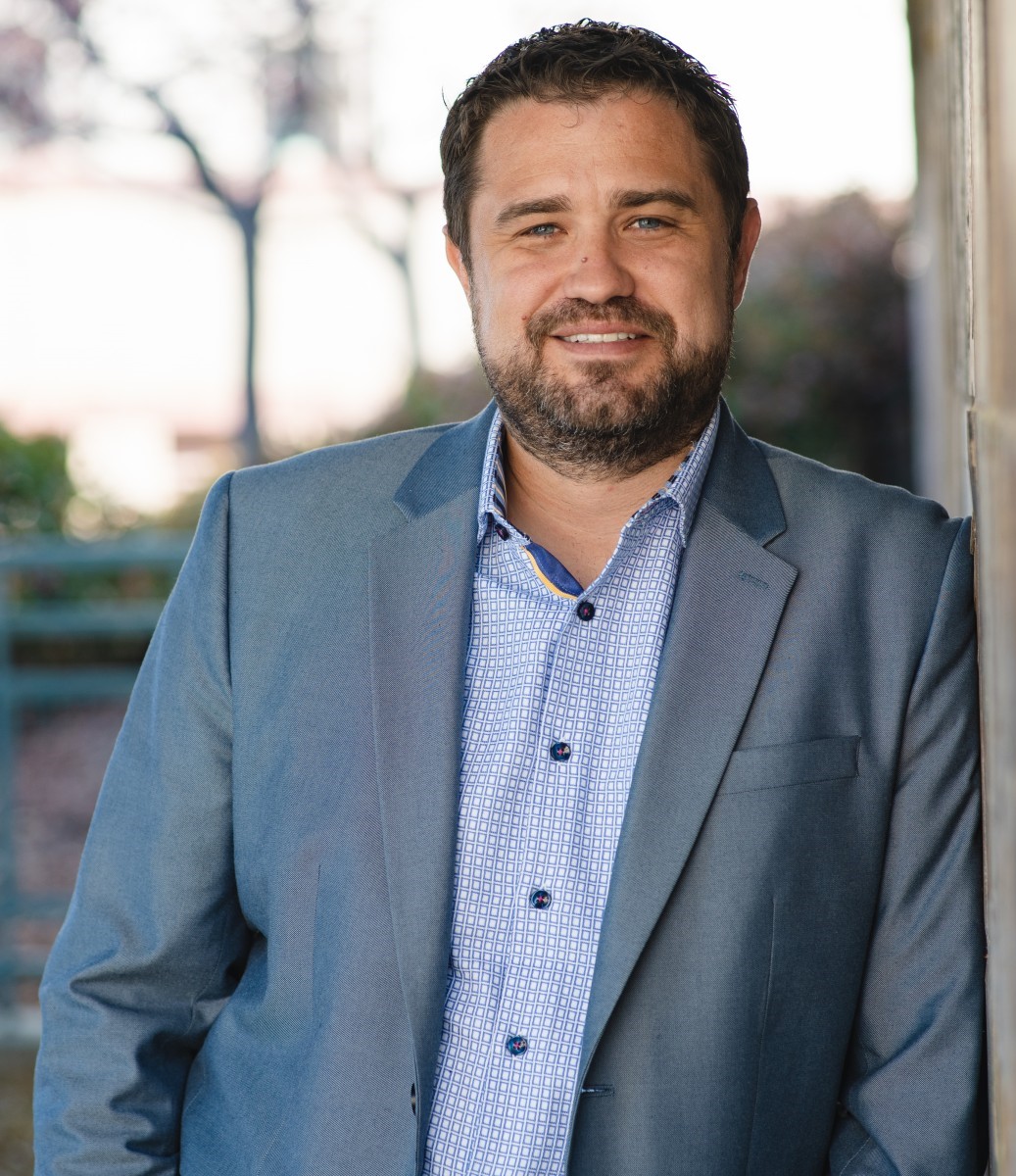 a man wearing a blue suit