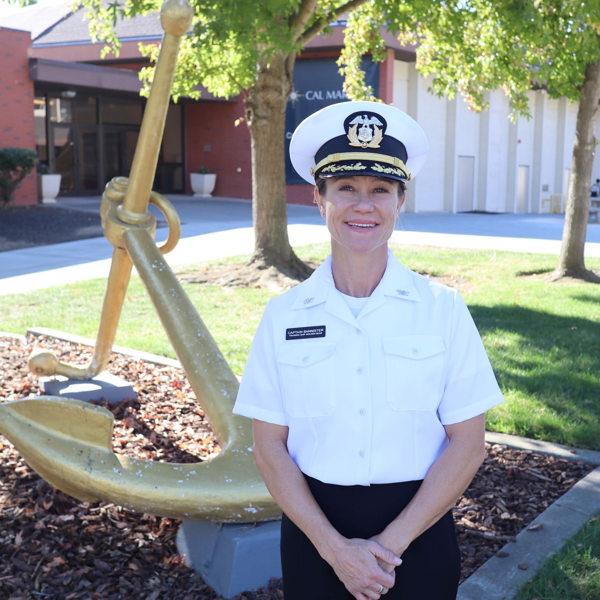 A woman wearing a captains uniform 