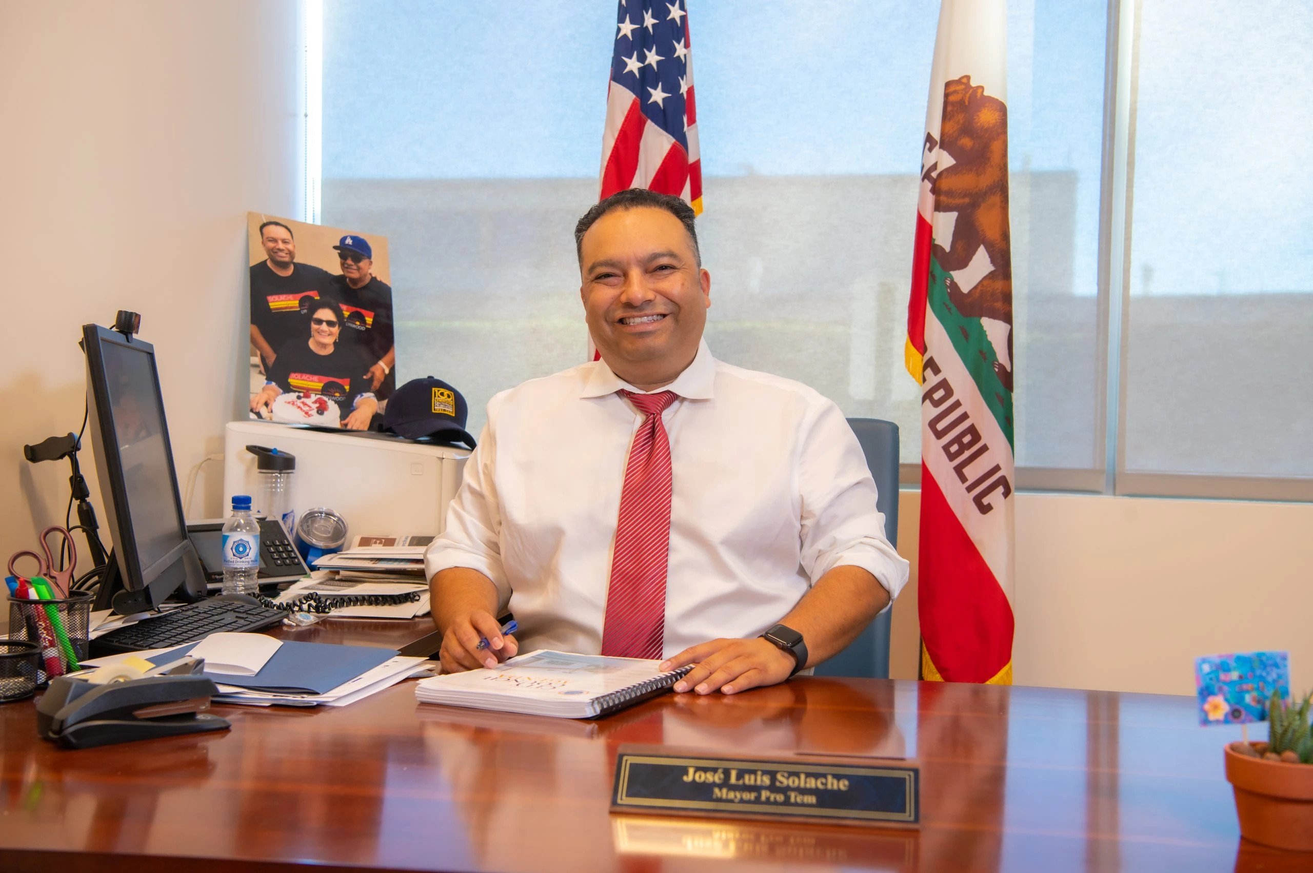 a man sitting behind a desk