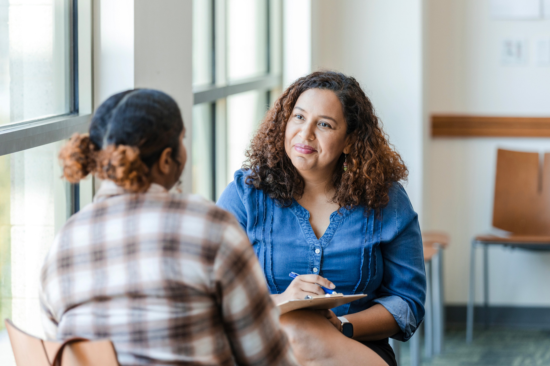 a counselor talking with a student