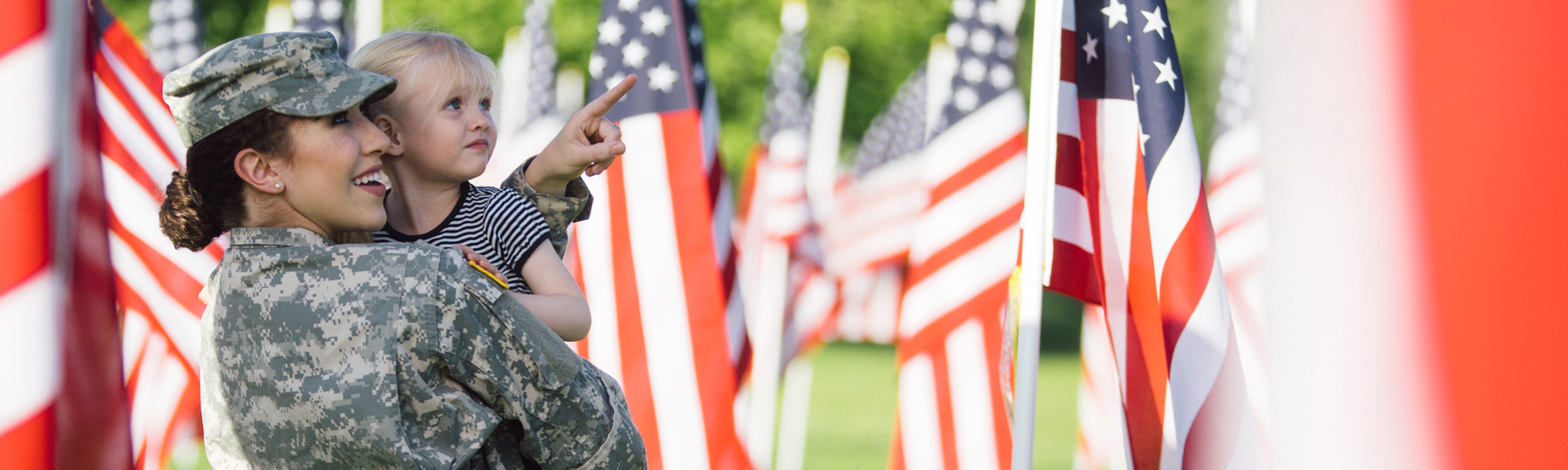 woman in military dress uniform raising right hand