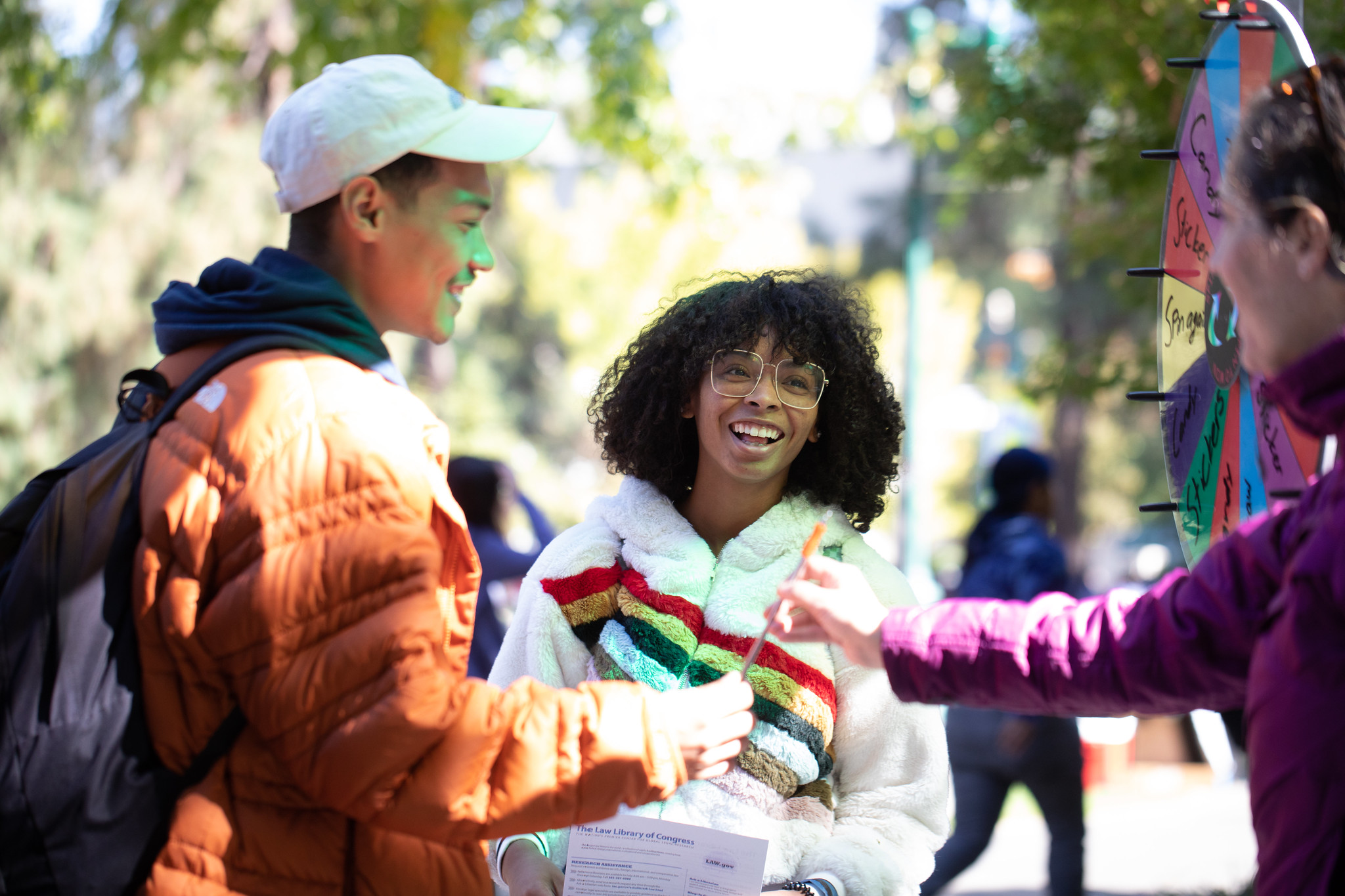 students smiling on a college campus