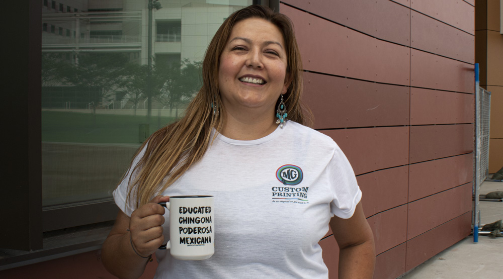 Maritza Gomez holds a coffee cup.