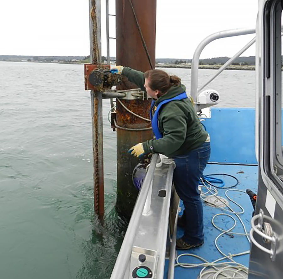 Amanda Admire performs a site maintenance check and cleaning at one of the PORTS stations.