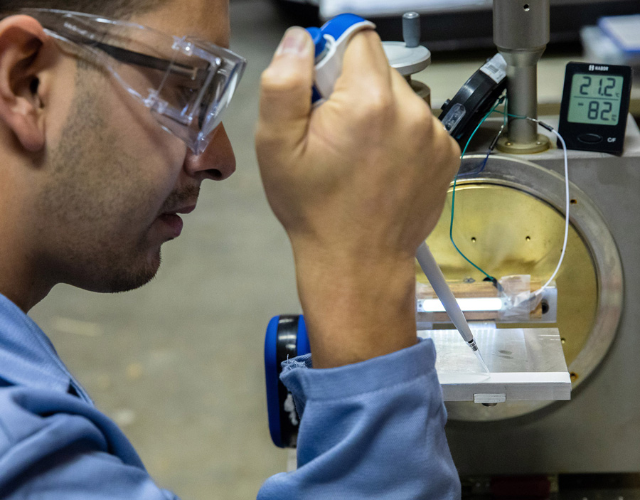 Ramirez applies a drop of fuel to a sample holder.