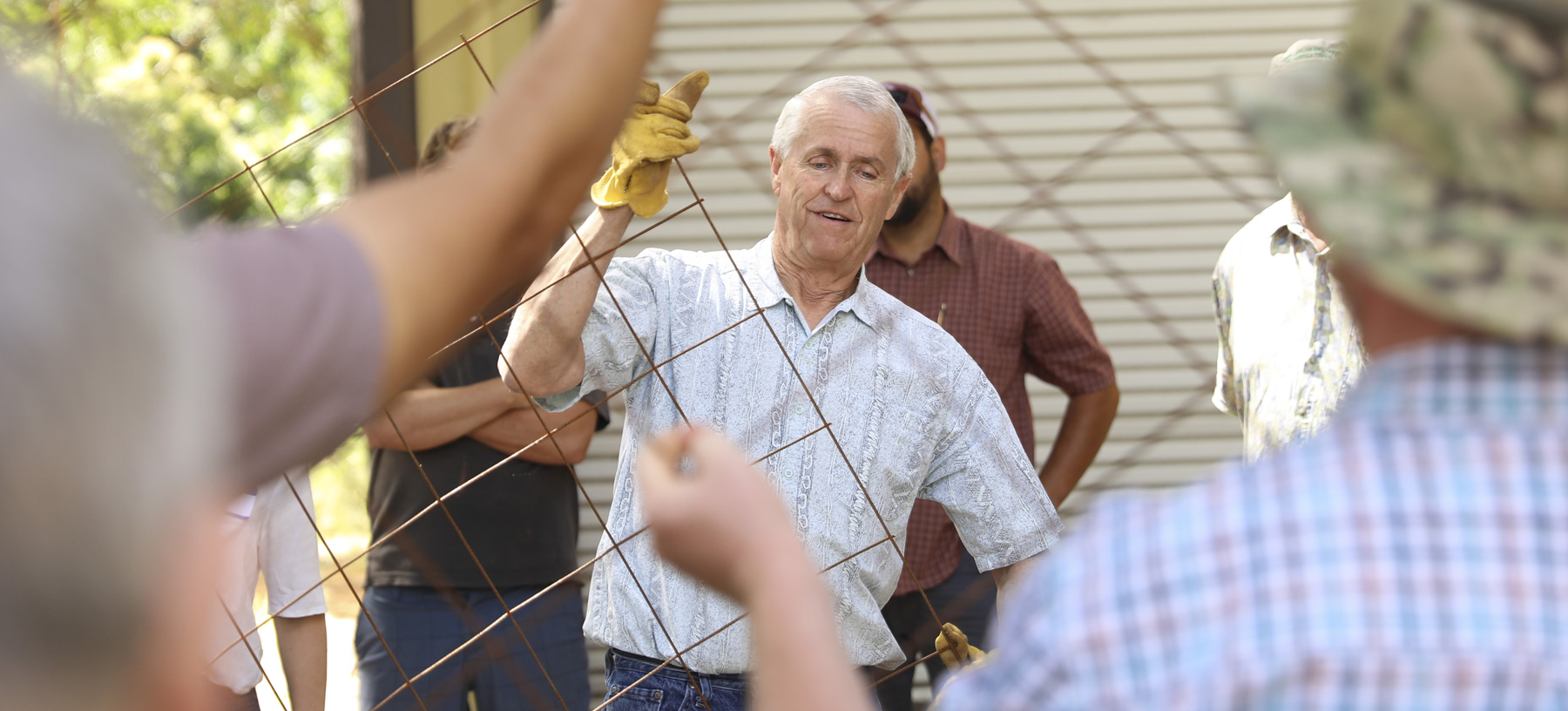 Dr. David Johnson builds a bioreactor used to make the compost for fertilizing during a workshop demonstration.