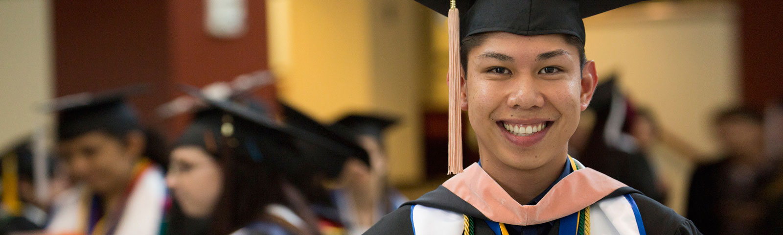 graduating student smiling