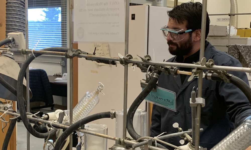 Dr. George Vourlitis working with lab equipment
