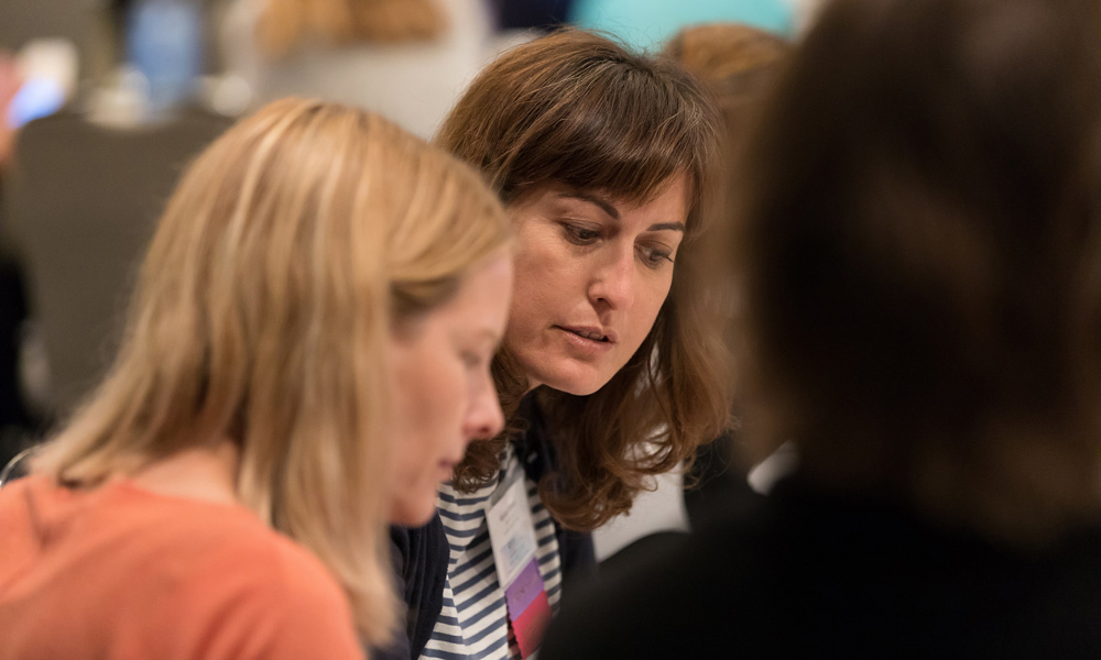 two women at a conference