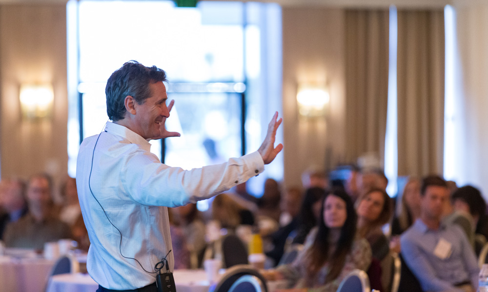 male speaker at a conference