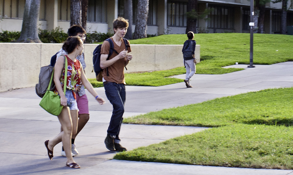 students walking across campus