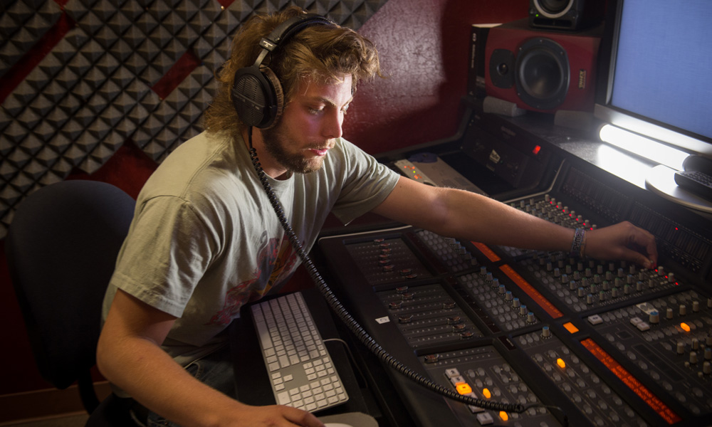 CSUMB Associate Professor Jeffrey Jones working wth a mixing board