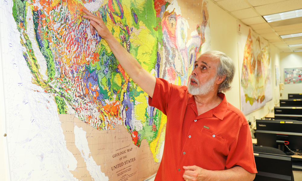 Victor Camp pointing to a map