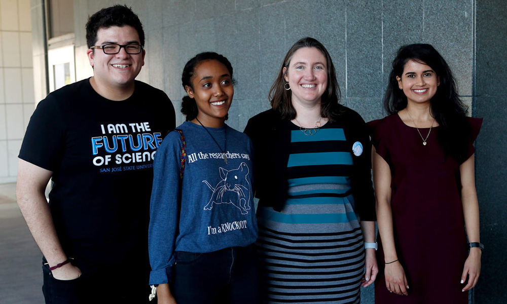 Katie Wilkinson, associate professor of biological sciences at San José State posing with students