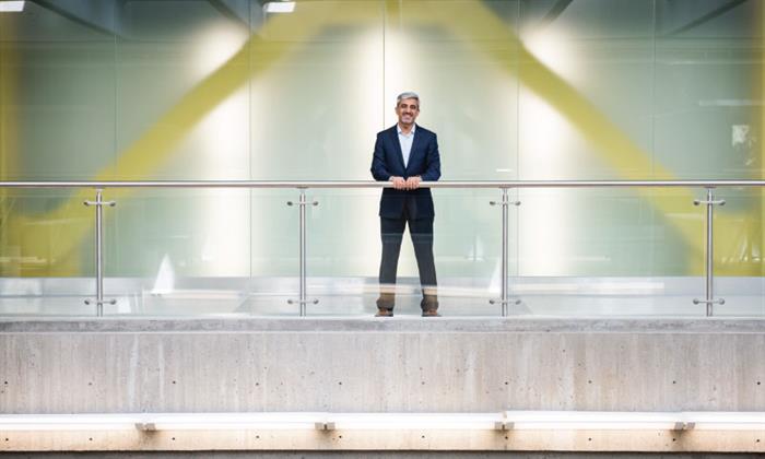 Muhammed leaning against railing