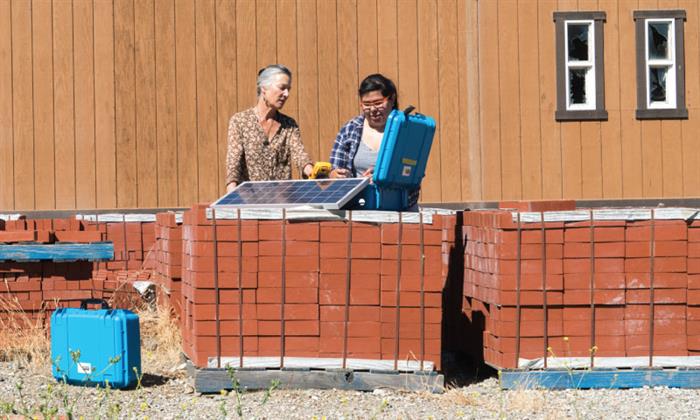 Karina adjusting a solar panel