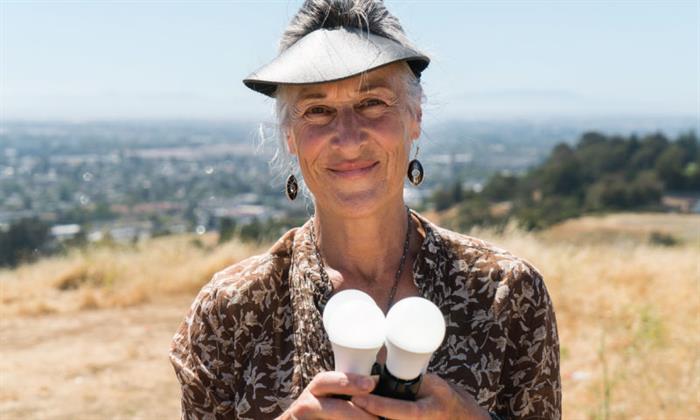 Karina holding lightbulbs