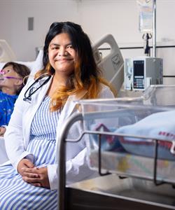 woman in smiling a hospital setting